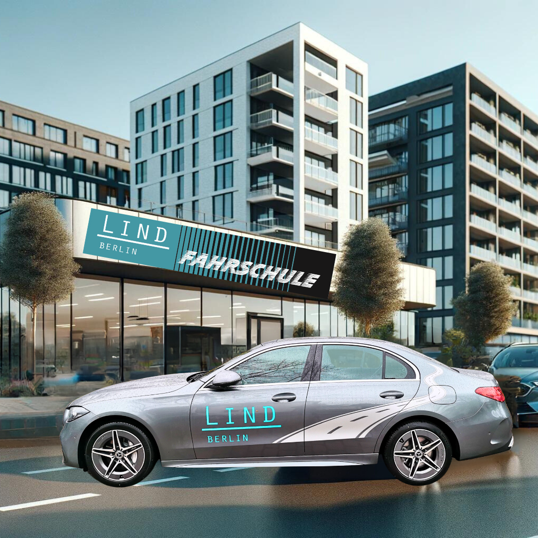 Ein modernes Fahrschulgebäude mit der Aufschrift "Fahrschule Lind" im Vordergrund.